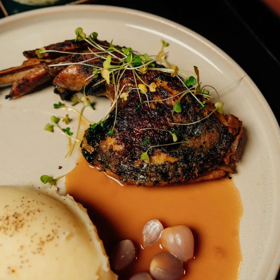 Guinea fowl, jollof jus — plated